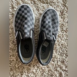 Brand new Vans “Off the Wall” checkered slip-ons.